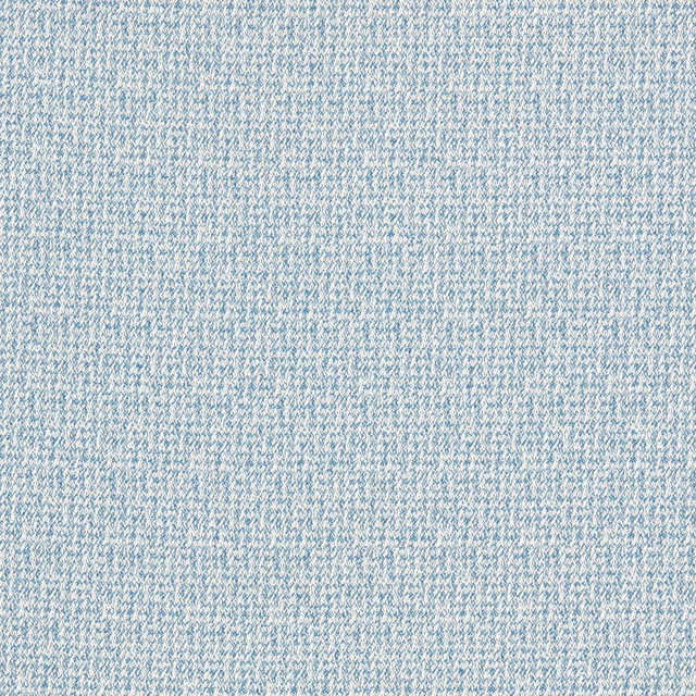 Close-up of cool denim-blue fabric with fine ivory flecks and a dense woven texture