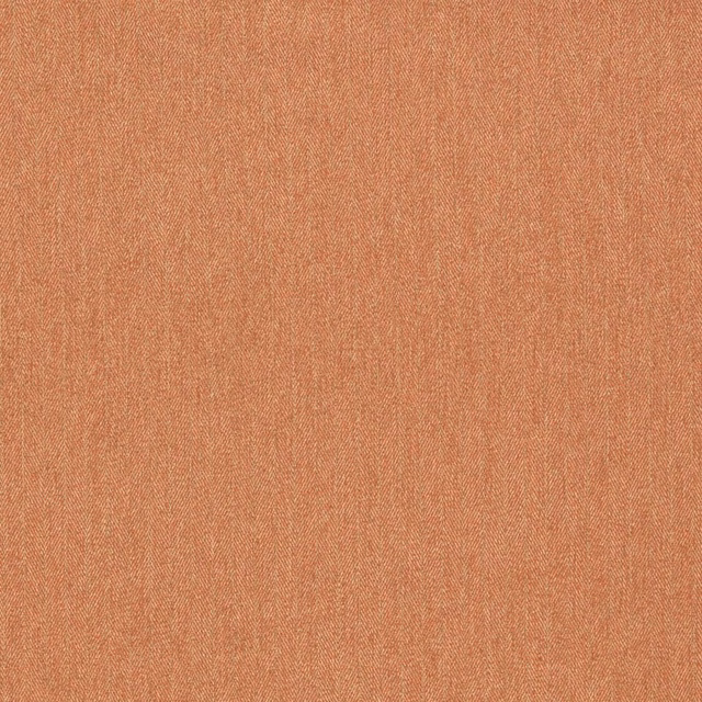 Close-up of muted turmeric-orange woven fabric with fine flecked texture