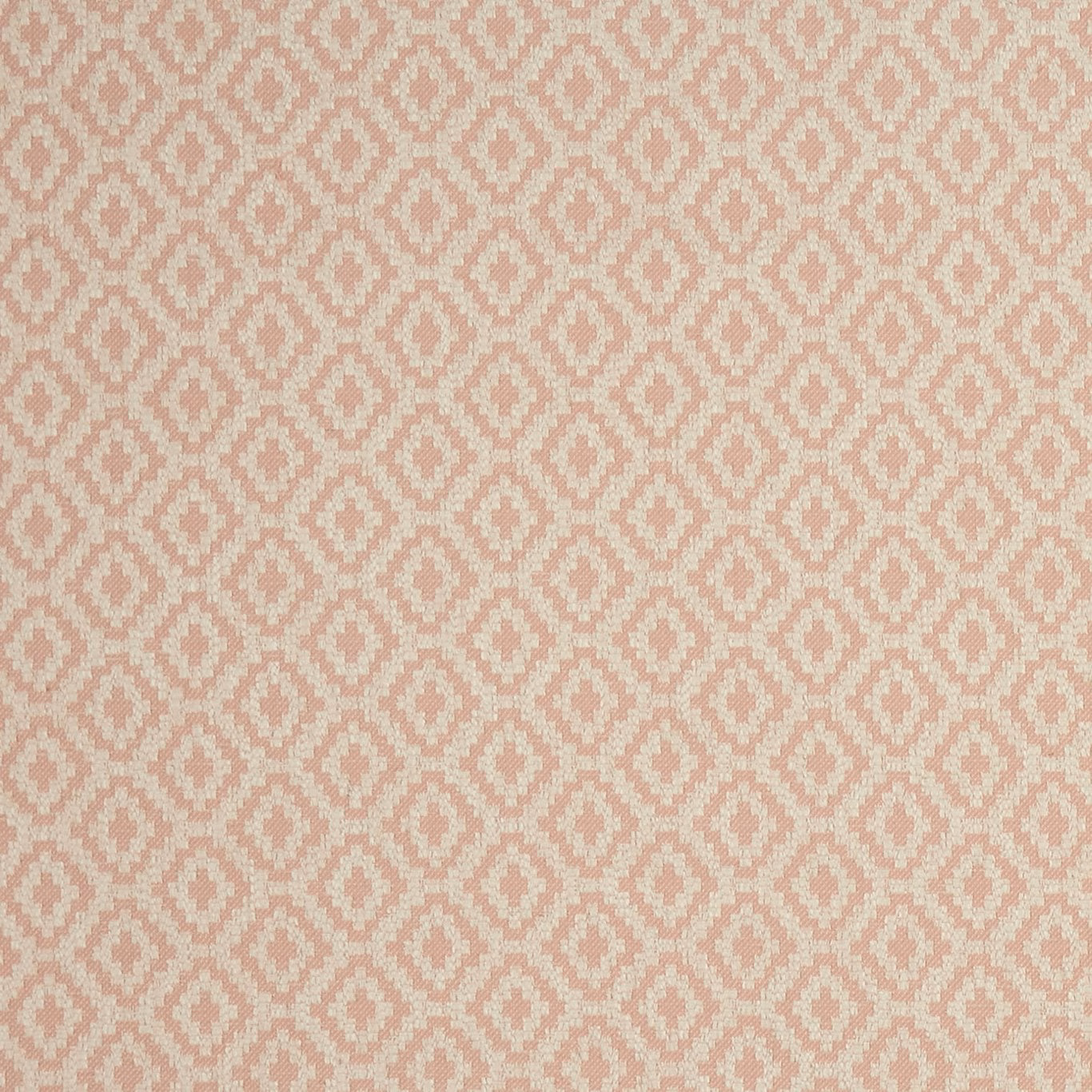 Soft blush pink and cream woven fabric with small repeating diamond motifs
