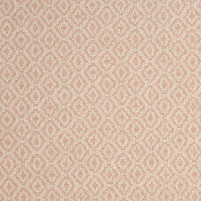 Soft blush pink and cream woven fabric with small repeating diamond motifs