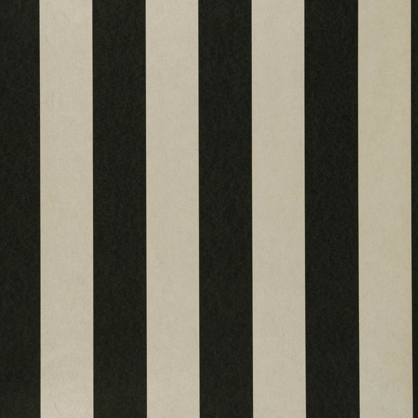 Deep ebony and pale ivory vertical stripes with a softly mottled surface