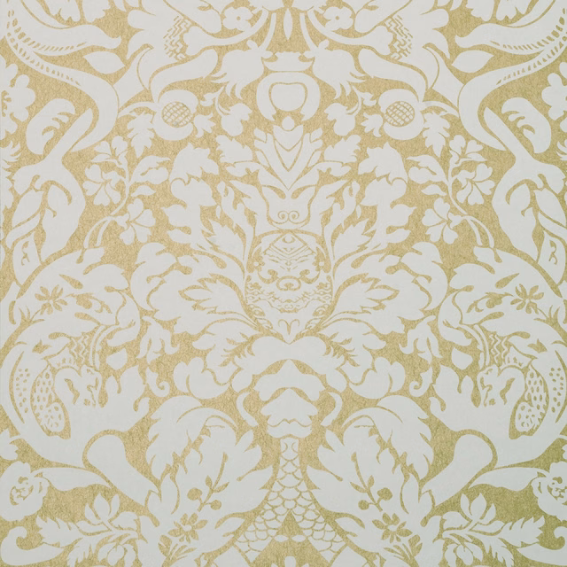 Warm antique-gold damask scrolls and florals on a soft cream ground