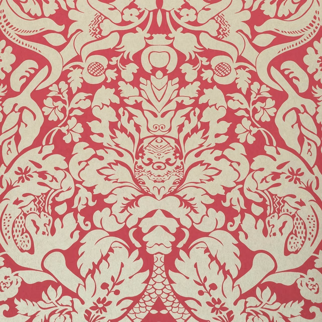 Muted raspberry wallpaper with cream symmetrical damask foliage and ornate floral motifs