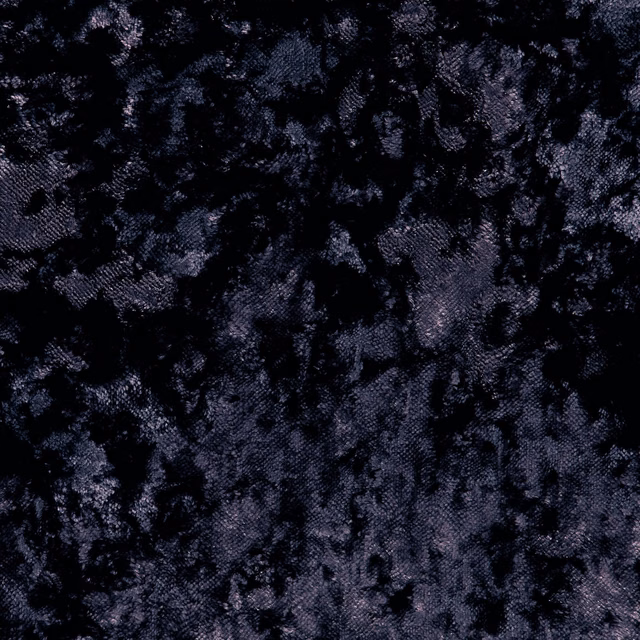 Close-up of deep charcoal black crushed velvet with mottled cool-toned highlights