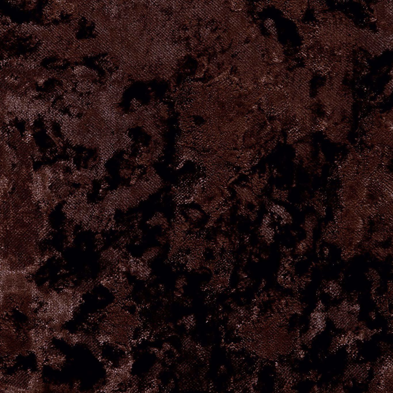 Deep chocolate brown woven fabric with irregular black mottled markings and dense texture