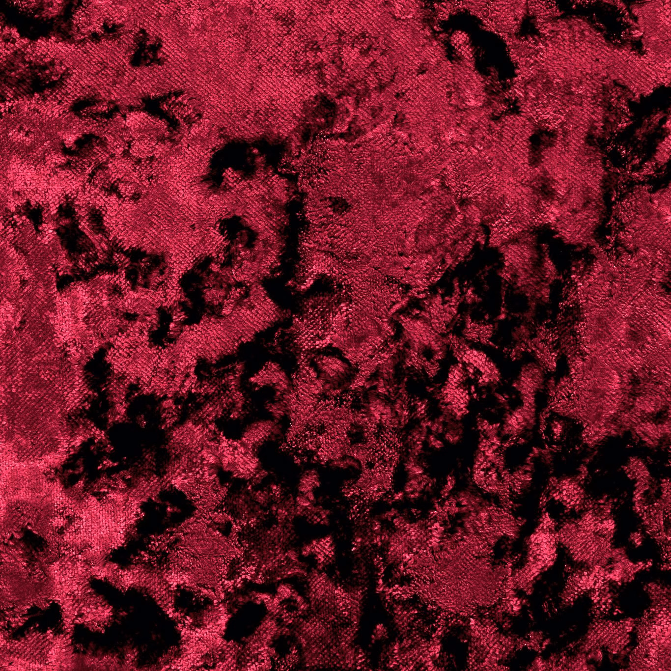 Saturated crimson crushed velvet with irregular black shadowing across the textured pile
