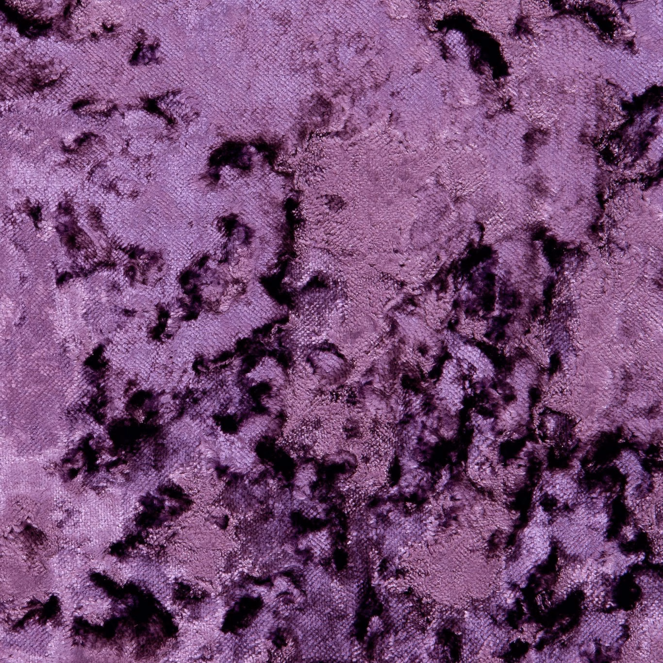 Grape-purple textured fabric with scattered black abstract markings and a softly nubby surface