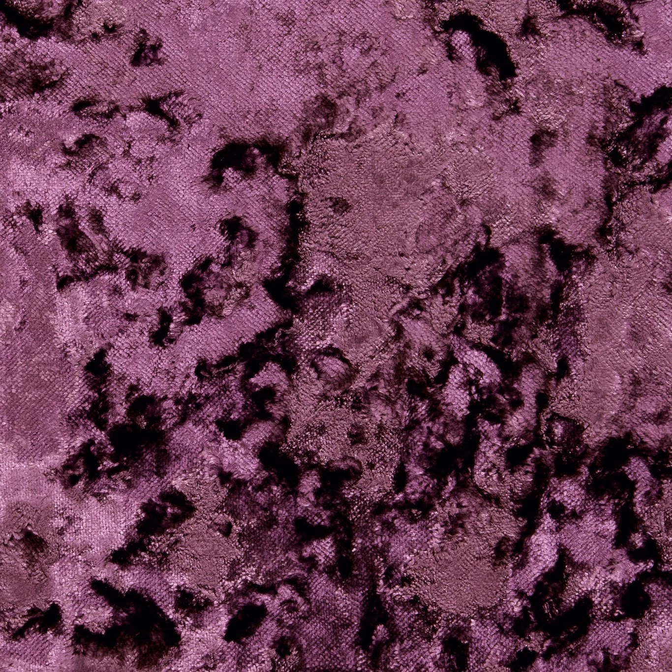 Dusky heather-purple plush weave with scattered black crushed-looking marks and subtle sheen