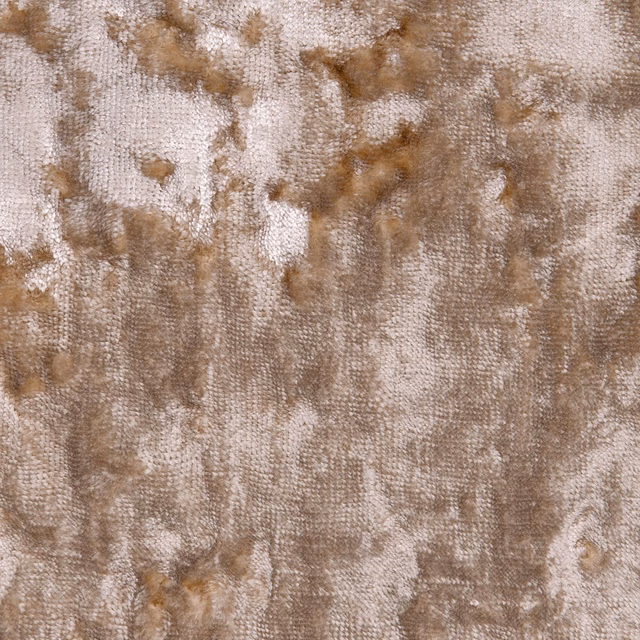 Warm sand upholstery textile with mottled taupe patches and a nubby woven surface