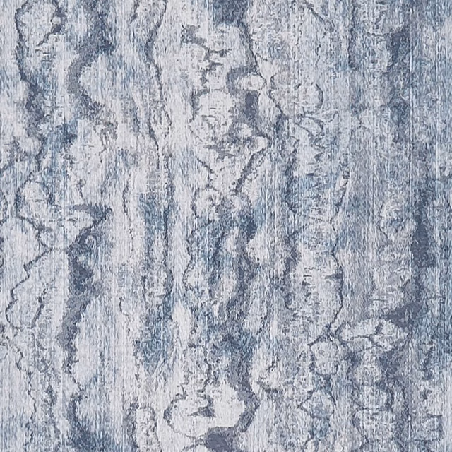Mottled denim blue-grey fabric with vertical painterly marbling and pale textured highlights