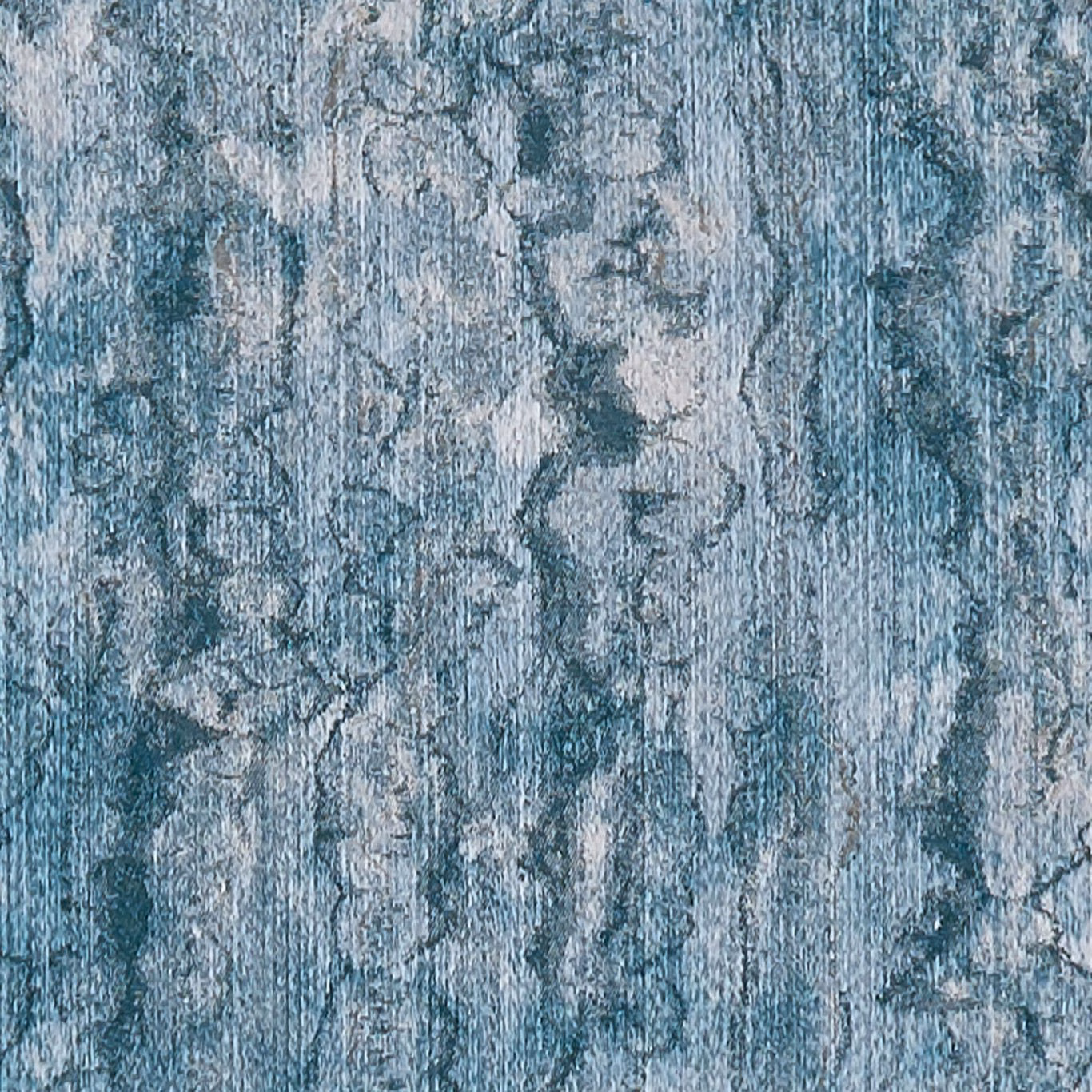 Muted kingfisher blue woven textile with silvery vertical abstract mottling