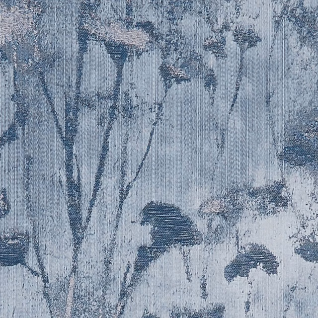 Cool denim-blue botanical fabric with dark stems, blurred blooms and fine vertical woven texture