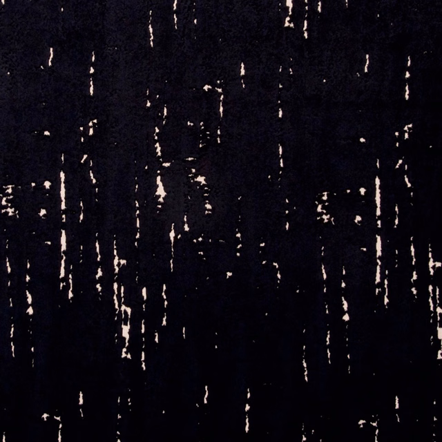 Near-black textile with broken ivory vertical streaks and a dense tactile surface