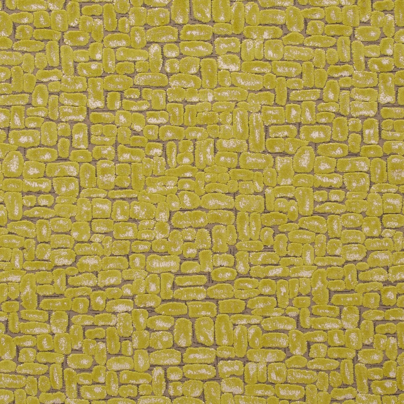 Warm citrus-lime textile with raised pebble-like geometric blocks and silvery highlights