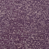 Deep damson purple fabric with pale flecked, irregular loop motifs and a tactile woven surface