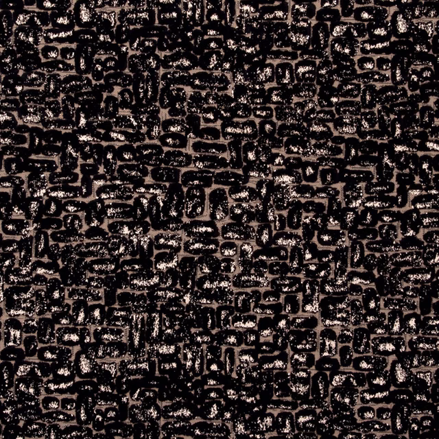 Ebony-black textured fabric with dense irregular geometric bars and warm brown highlights