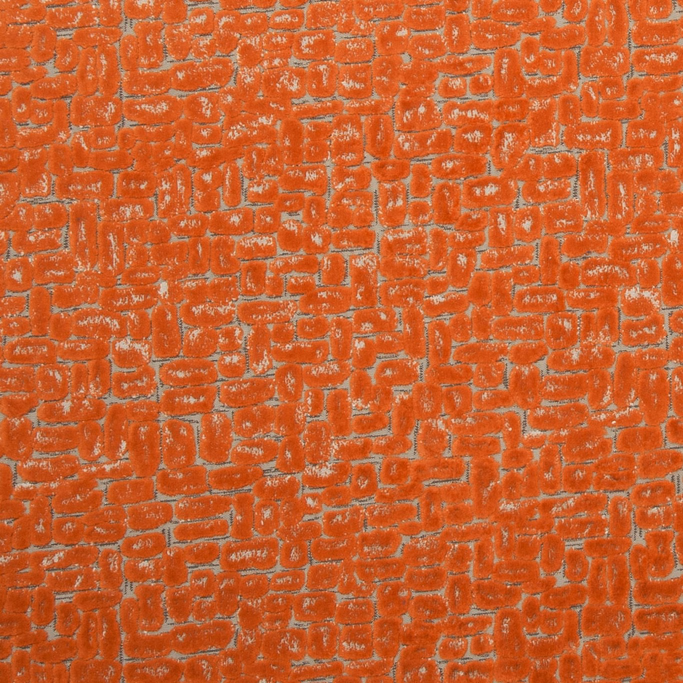 Burnt spice-orange textile with irregular raised brick-like weave and pale flecked highlights
