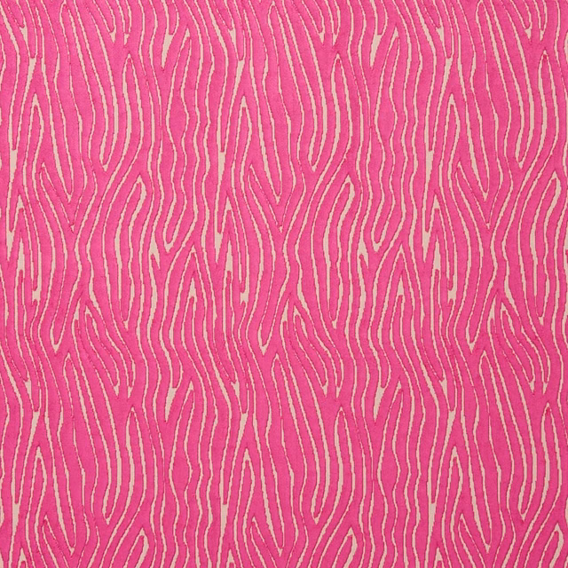 Vivid fuchsia textile with pale sinuous lines and a tactile woven surface