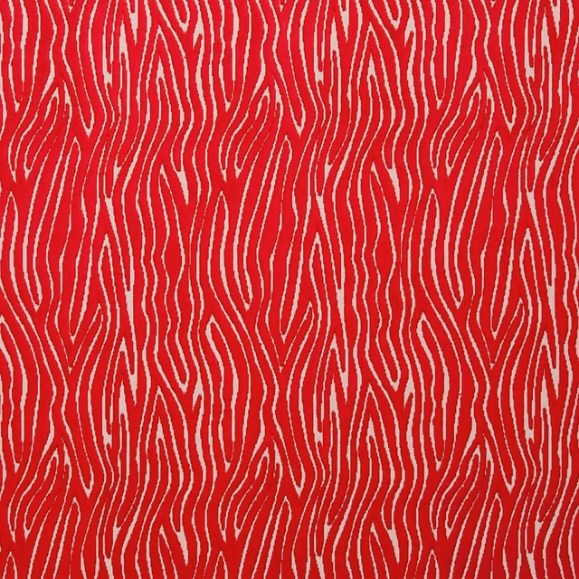 Saturated rouge-red textile with cream irregular vertical flowing lines and textured surface