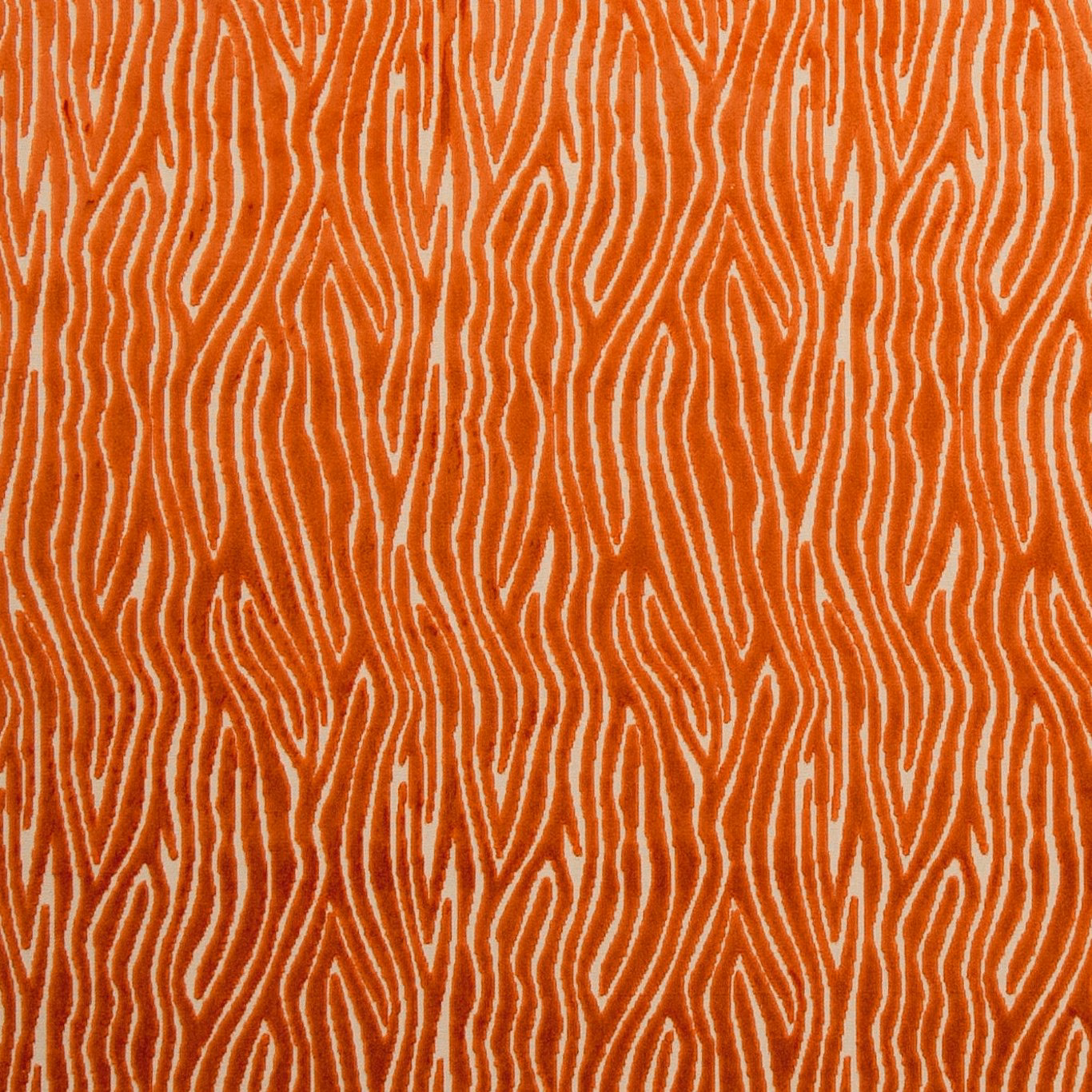 Warm spice-orange textile with raised cream contour lines in a dense repeat