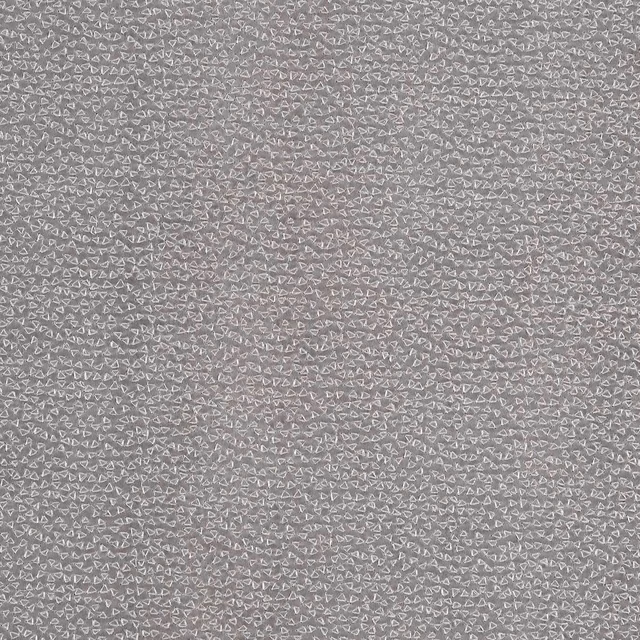Pewter-grey woven textile with dense tiny pale geometric loop motifs and soft texture