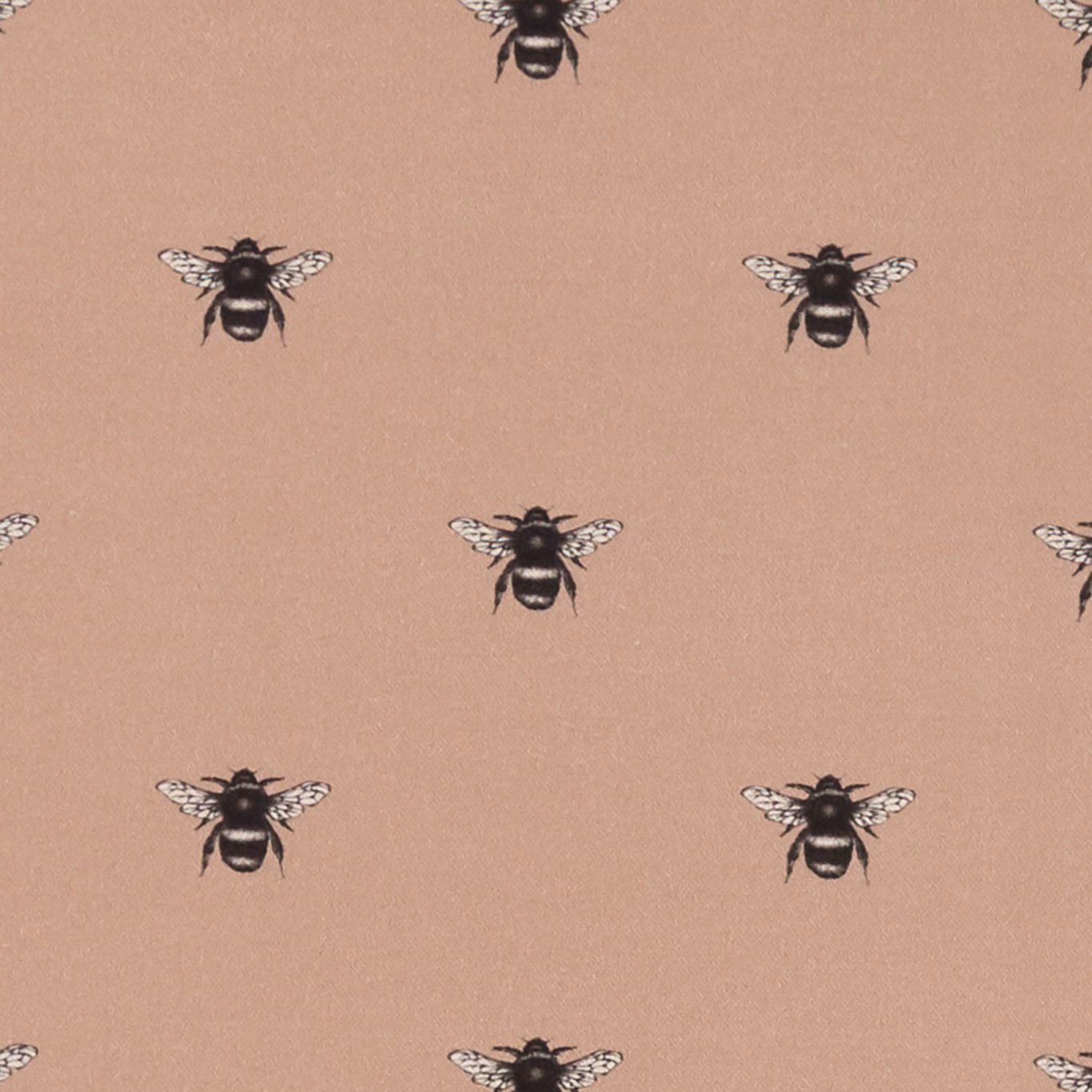 Blush pink fabric with spaced black-and-cream bee motifs and fine texture
