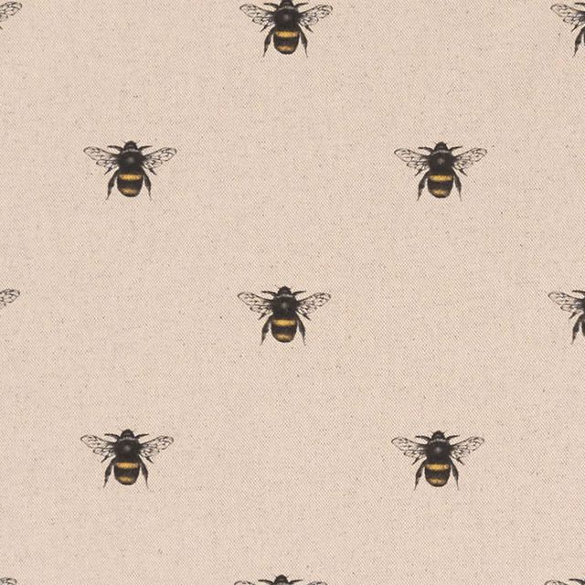 Pale beige woven fabric showing repeating black and ochre bees