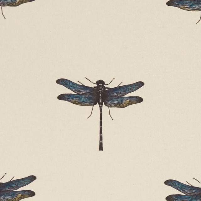 Cream fabric with a central dragonfly in blue, teal, charcoal and ochre