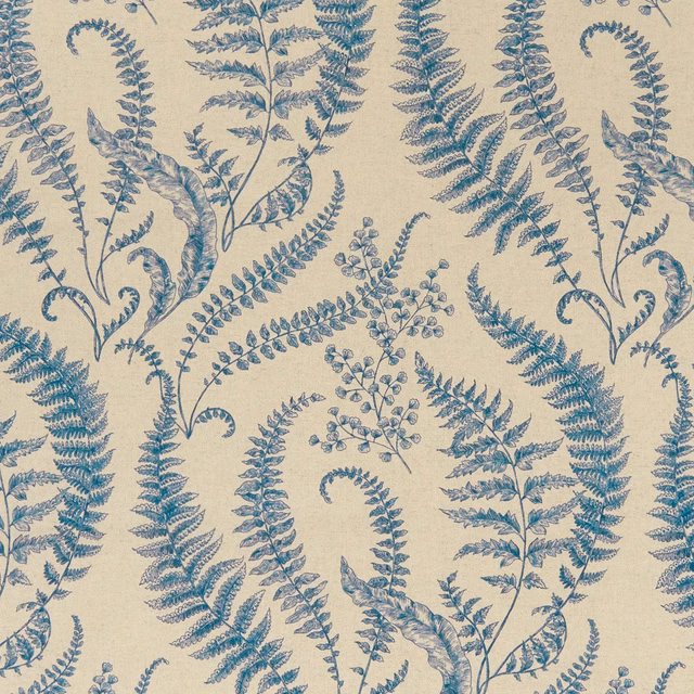 Muted denim-blue fern fronds on a warm beige, lightly textured fabric ground