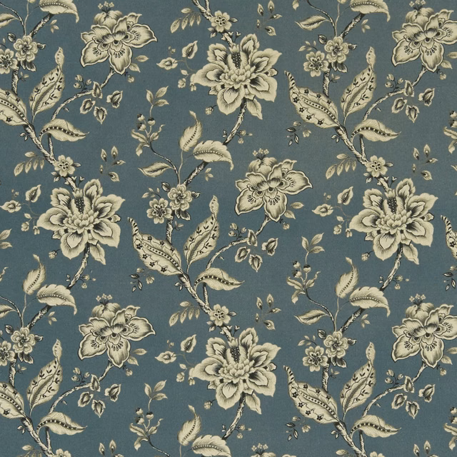 Muted denim-blue fabric with ivory palampore florals and curling leafy stems