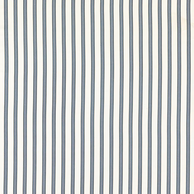 Close-up of fine denim-blue vertical stripes on a softly textured ivory fabric