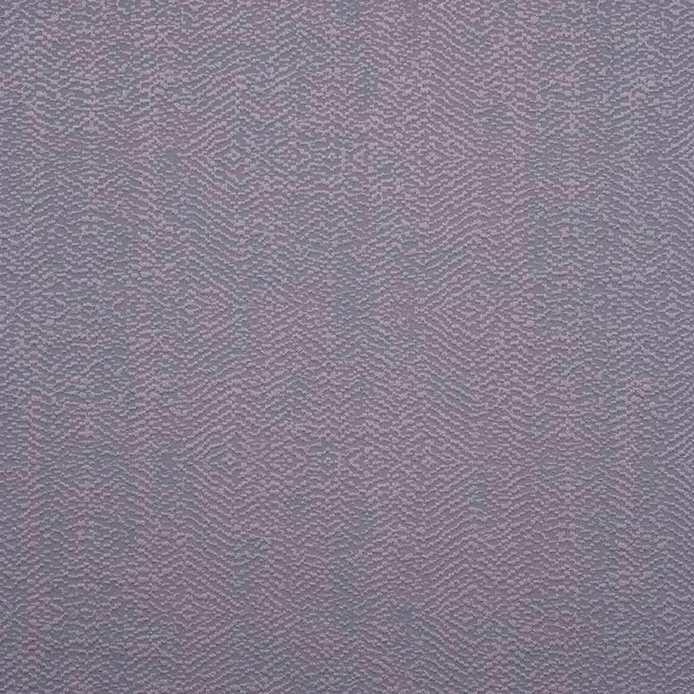 Close-up of mauve-flecked charcoal grey fabric with subtle rippled geometric weave
