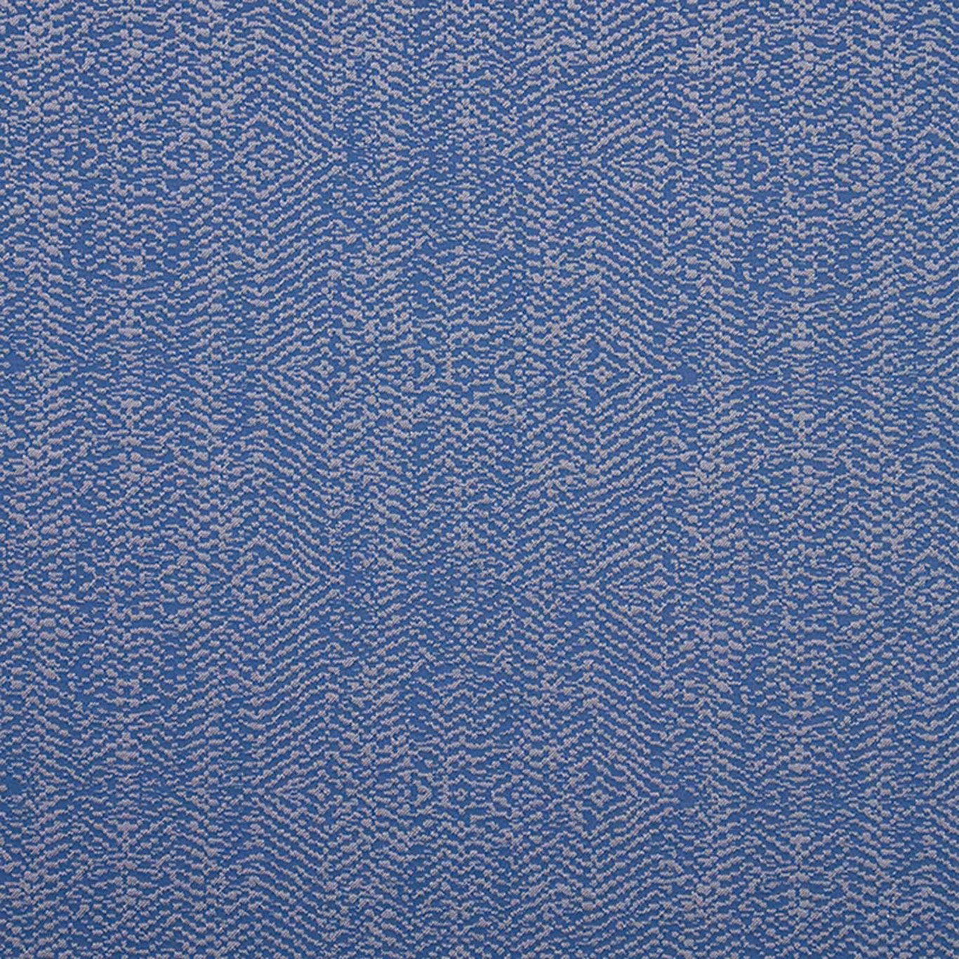 Muted denim-blue textile with pale lilac flecks and irregular vertical woven bands
