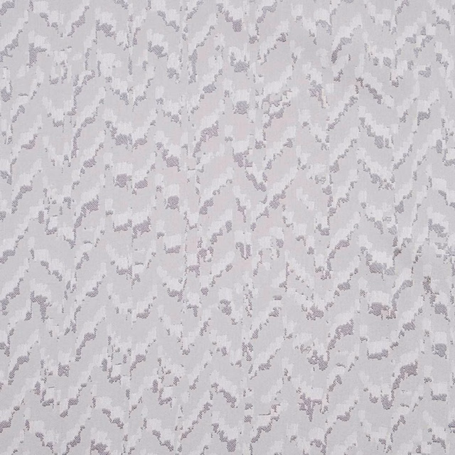 Cool silver-grey fabric with softly mottled lilac-grey abstract woven fragments