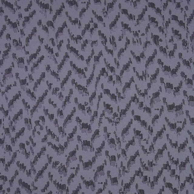 Cool zinc-grey woven ground with charcoal fragmented zigzag marks and lavender undertones