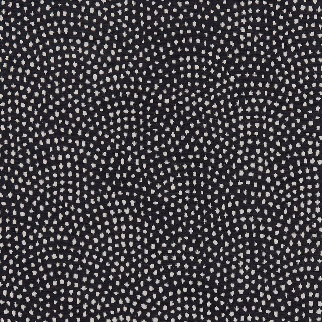 Charcoal-black woven fabric with tiny ivory flecks in rippling geometric rows