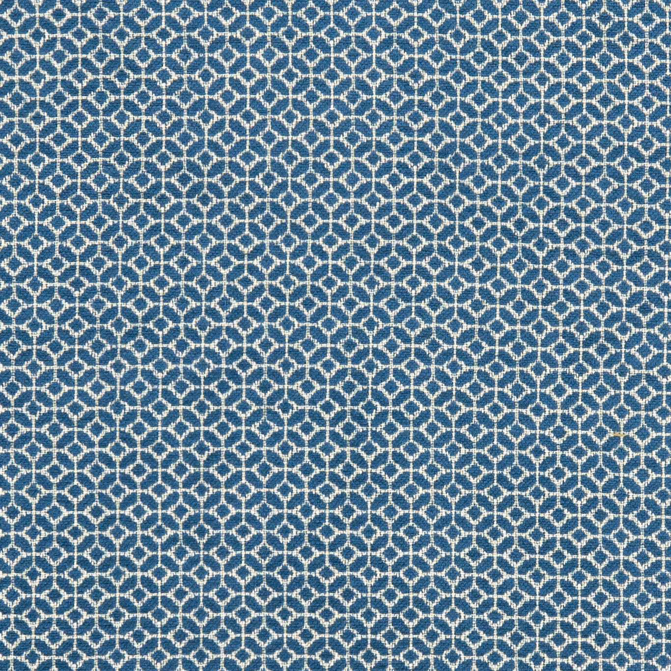 Cool denim-blue woven fabric with a small cream interlocking diamond pattern and textured surface
