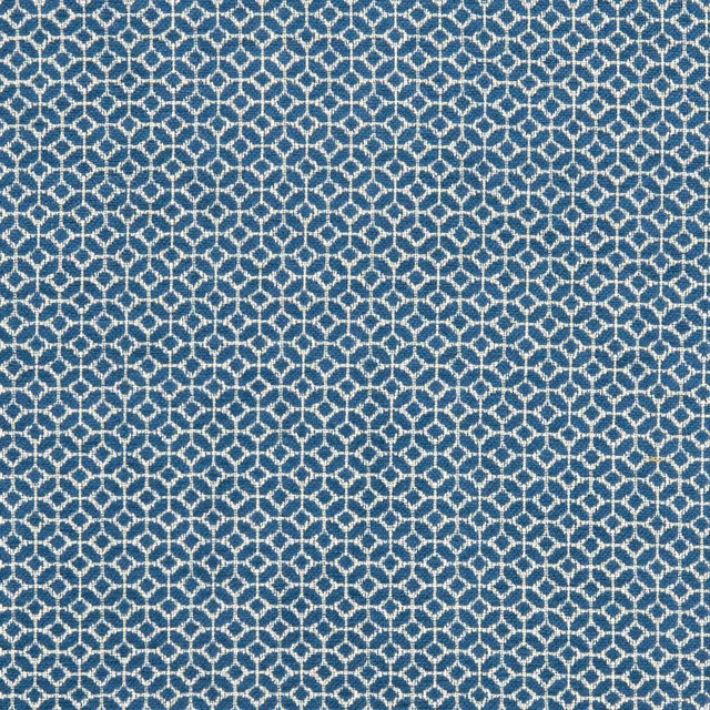 Cool denim-blue woven fabric with a small cream interlocking diamond pattern and textured surface