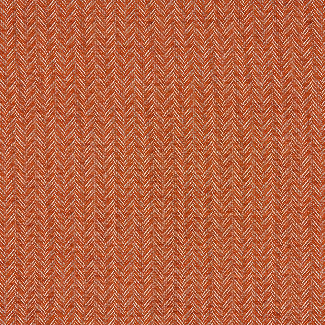 Warm rust upholstery fabric with fine cream herringbone chevrons and textured woven surface