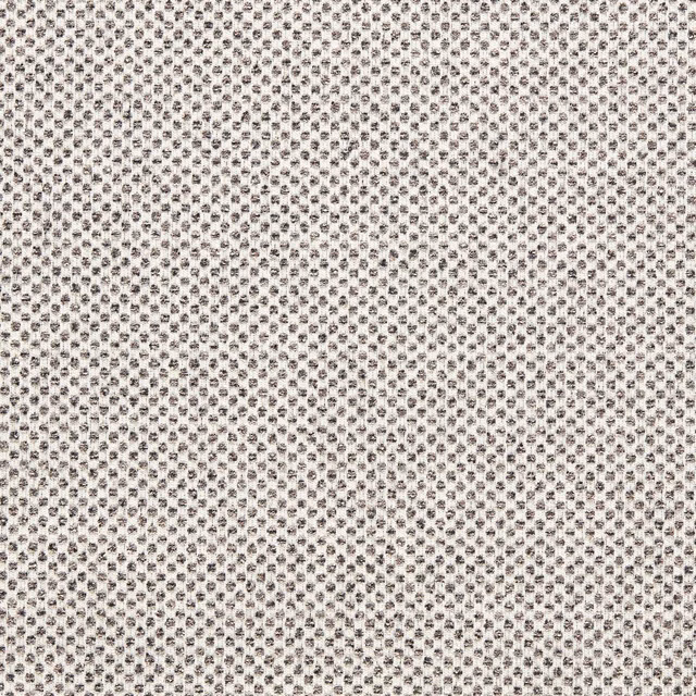 Charcoal-black geometric flecks woven across an ivory textured upholstery fabric