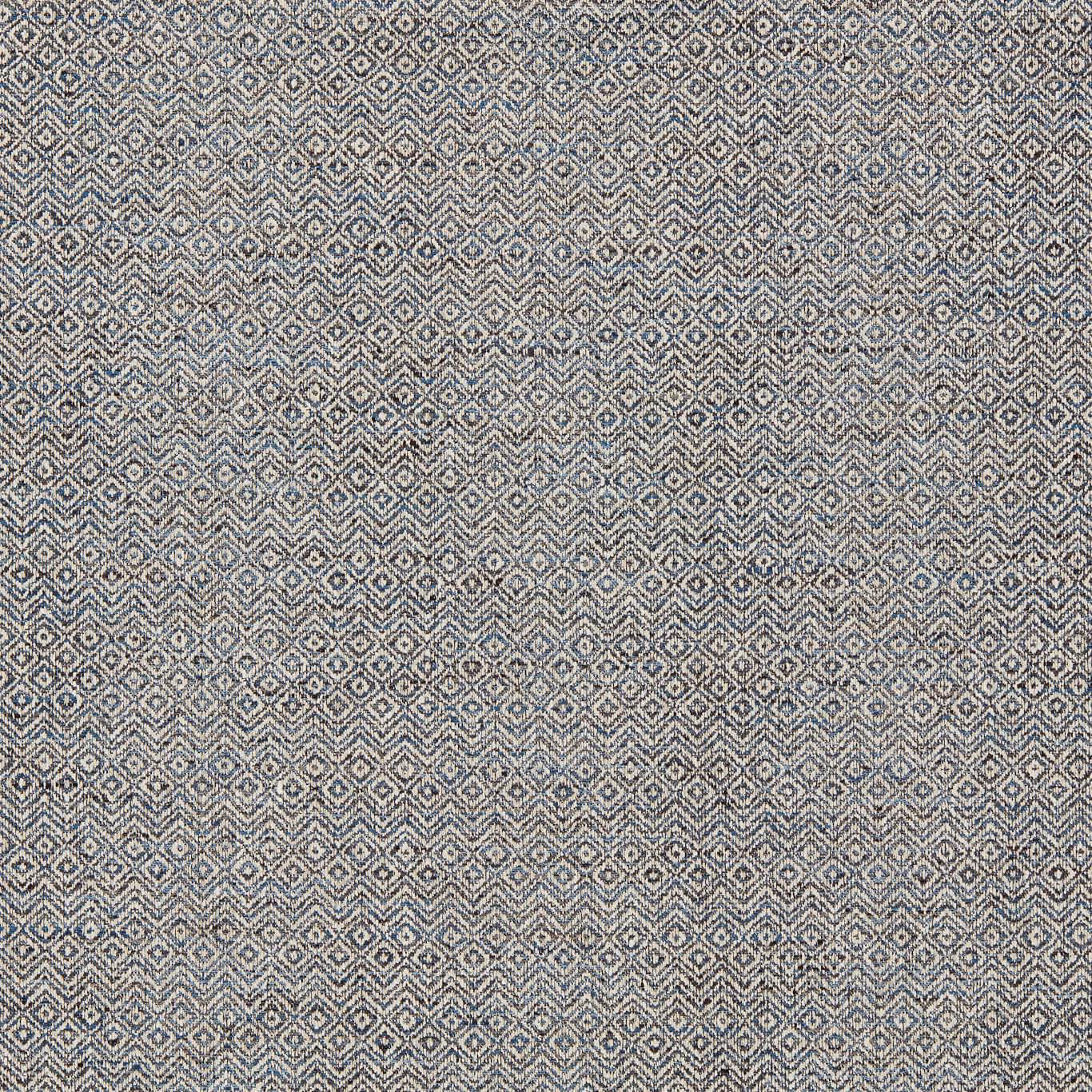 Midnight blue-grey woven fabric with tightly repeated pale diamond and zigzag motifs