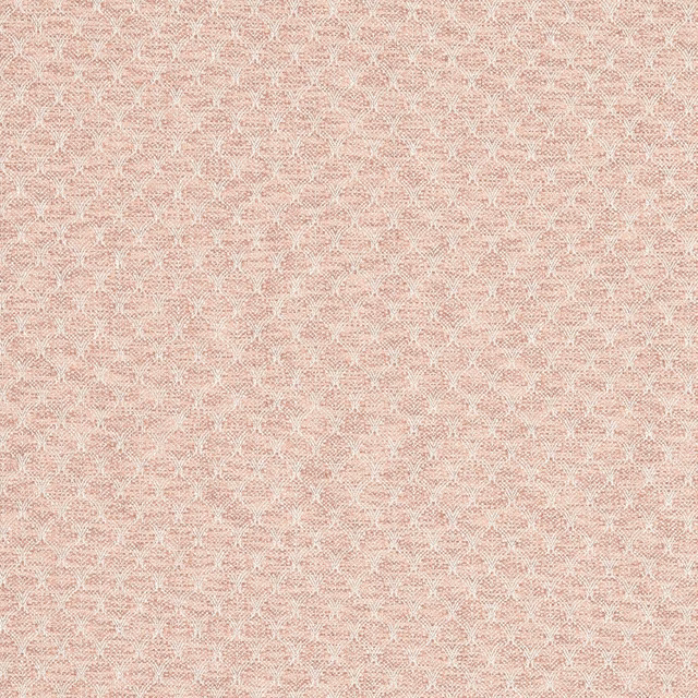 Close-up of dusty blush-pink woven fabric with a tiny cream trellis repeat