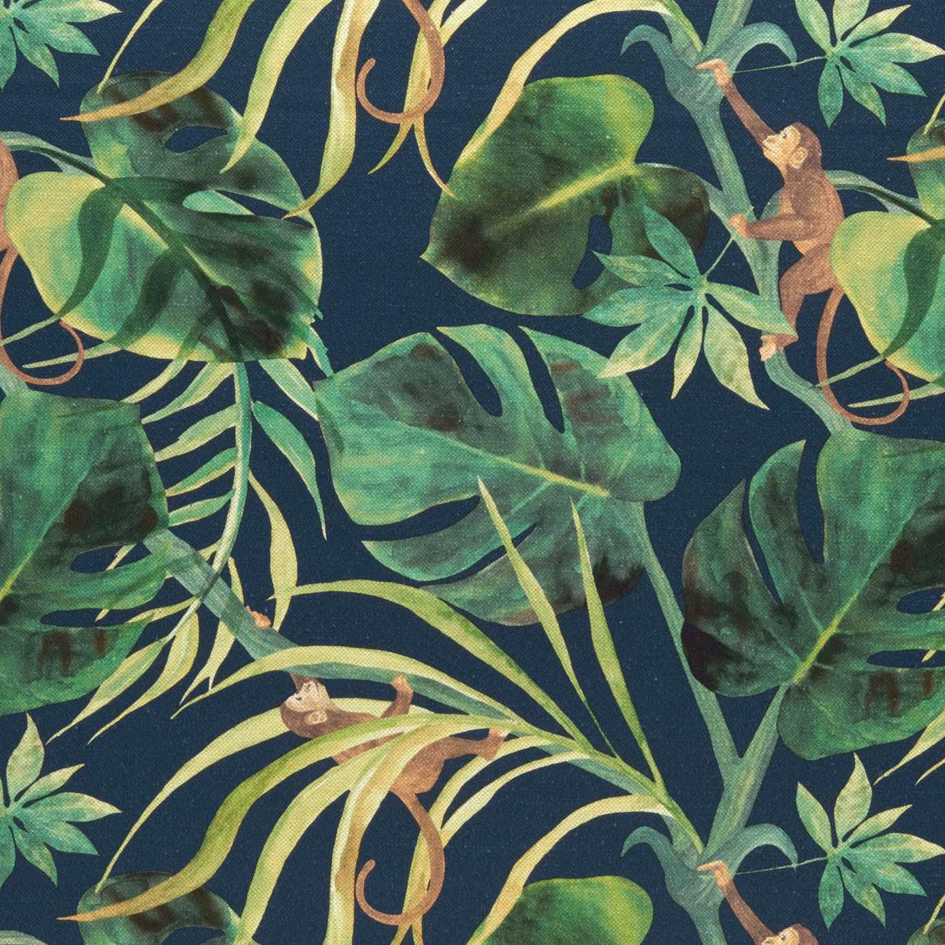 Deep indigo fabric with green tropical leaves, pale fronds and russet monkeys
