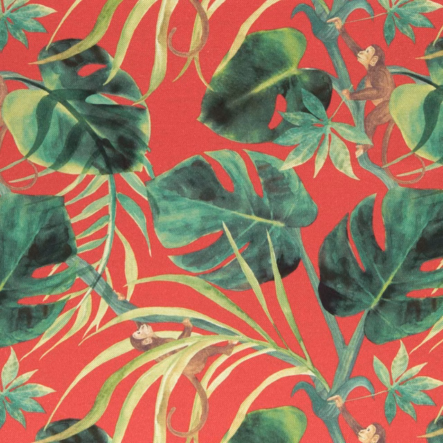 Rouge red jungle fabric with layered green leaves, curling vines and monkeys