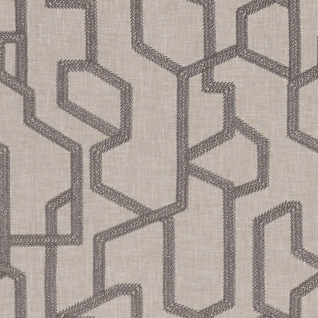 Warm taupe woven fabric with charcoal interlocking angular links and chevron texture