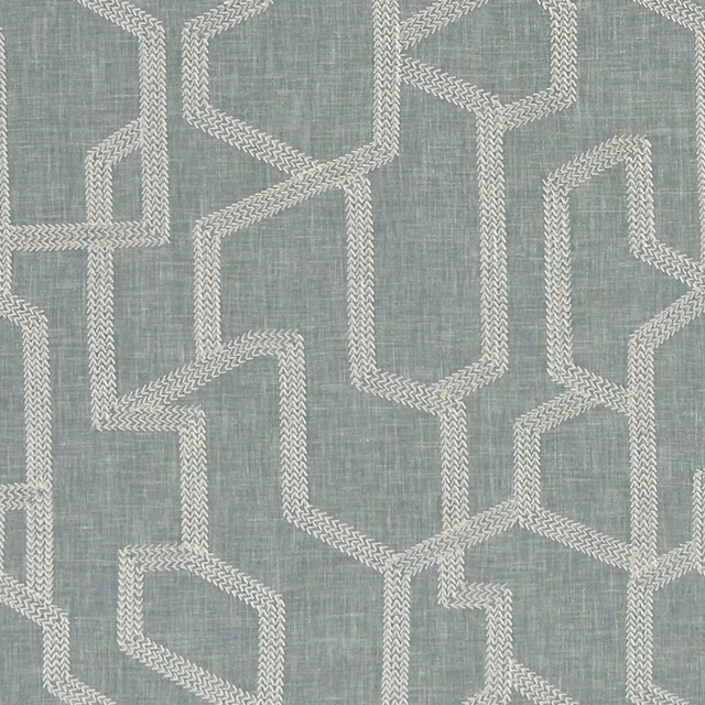 Cool blue-grey woven fabric with ivory interlocking chevron geometry and crosshatched texture