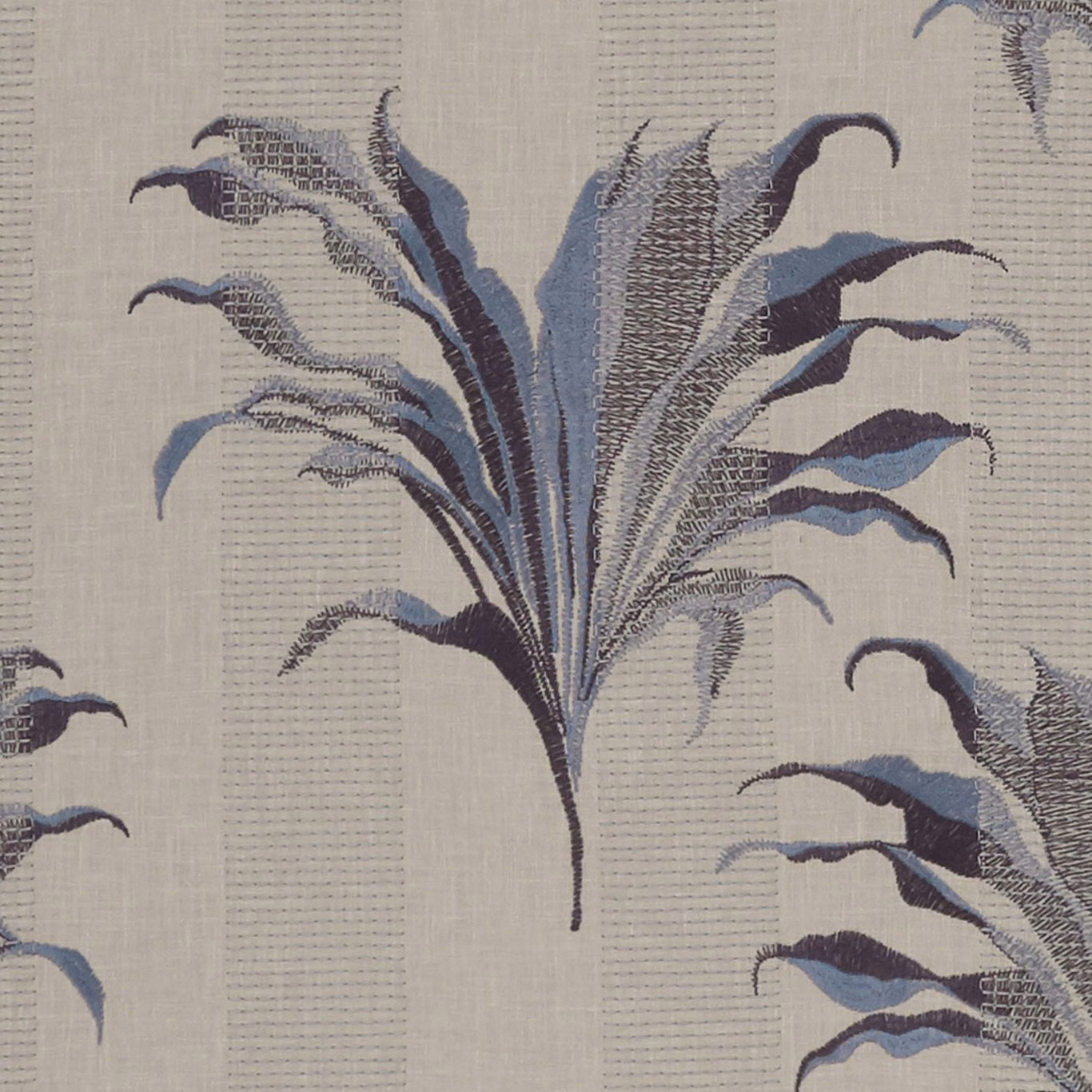 Pale greige woven textile with sweeping denim and midnight botanical leaves