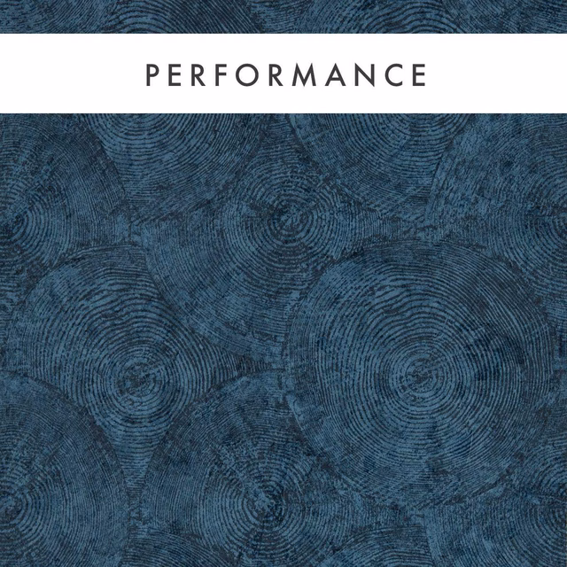Deep blue-green wallpaper with layered circular tree-ring motifs and dark tactile texture