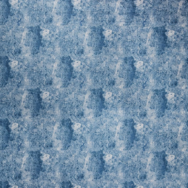 Mottled midnight blue fabric with pale chalky flecks and textured painterly marks