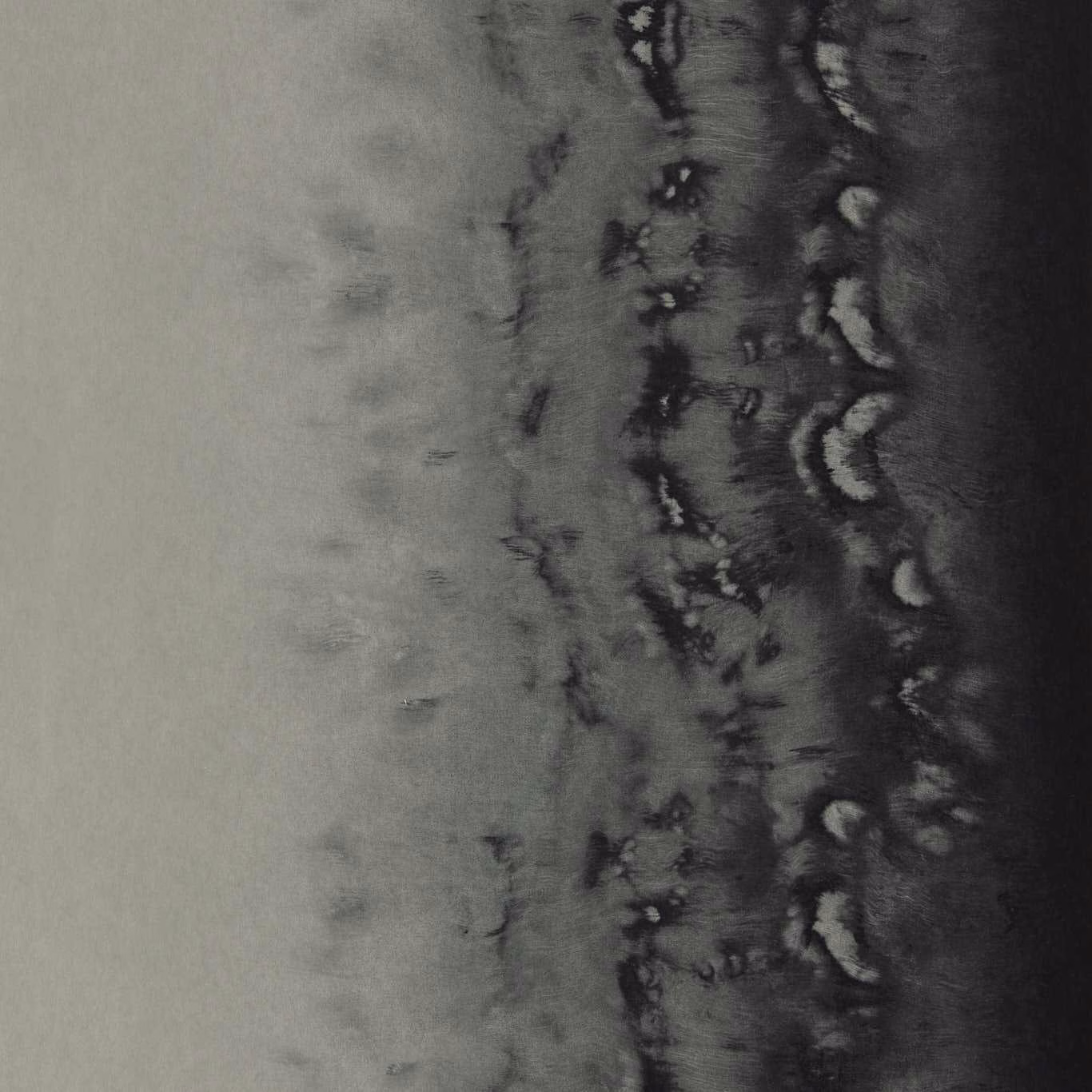 Cool silver-grey wallpaper with a charcoal vertical band and distressed pale marks